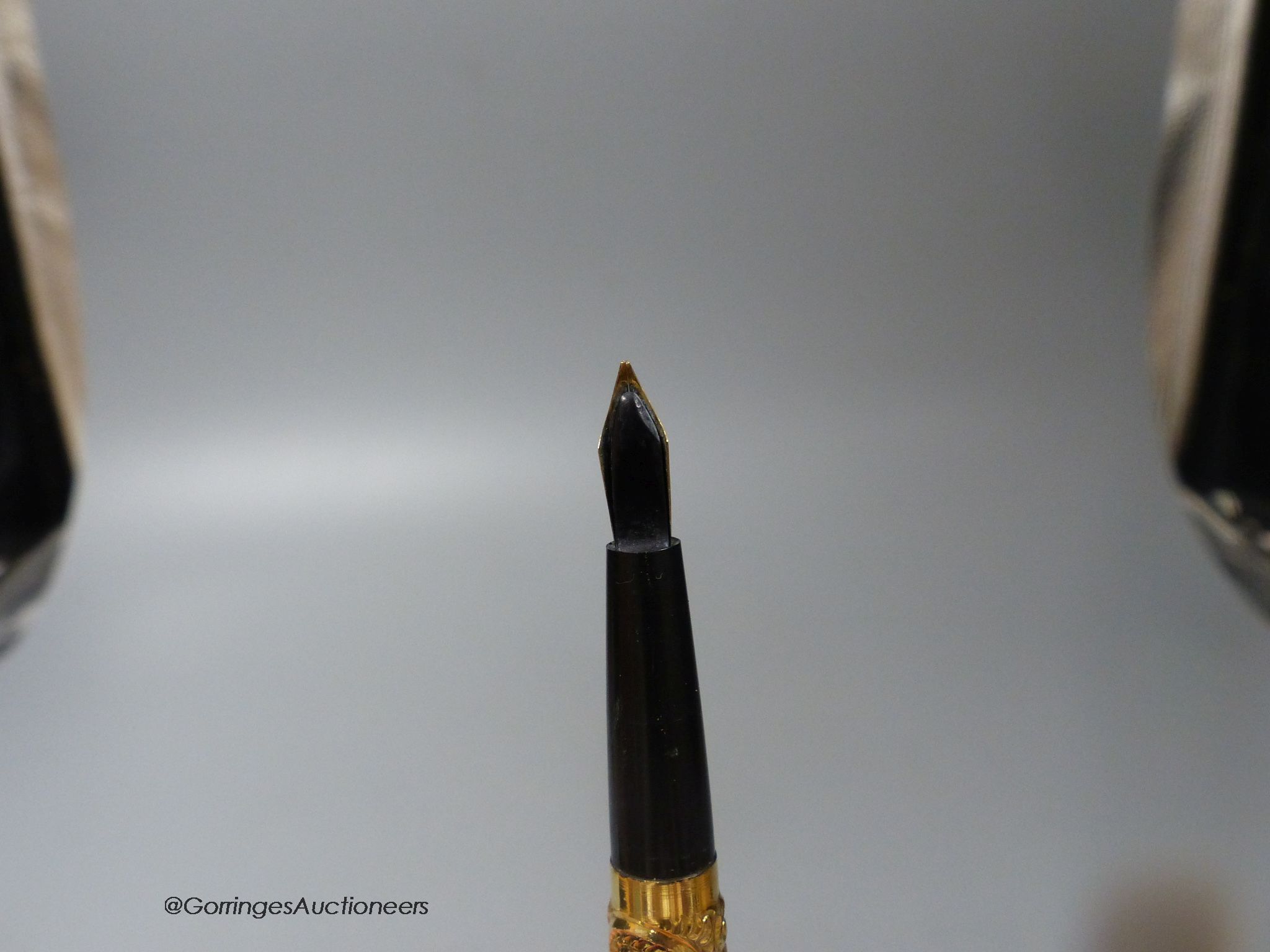 A 1920's gold plated eye-dropper fountain pen